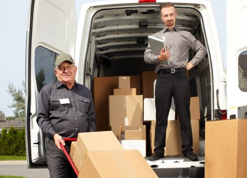 Moving boxes and furniture during a Chelsea relocation