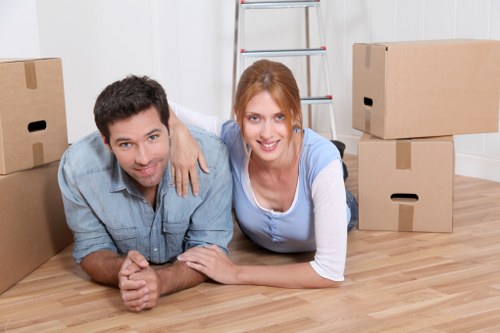 Local house movers in Chelsea navigating a residential street with moving equipment