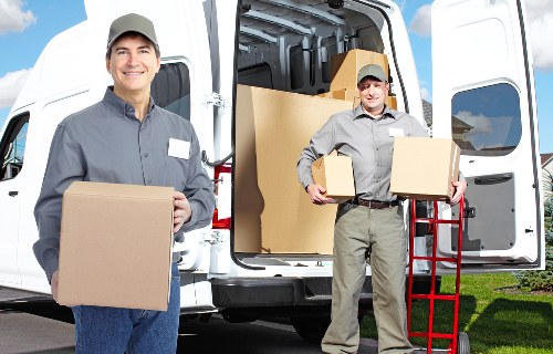 Staff using careful lifting techniques during a move