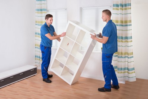Local movers handling furniture during a Chelsea same day move